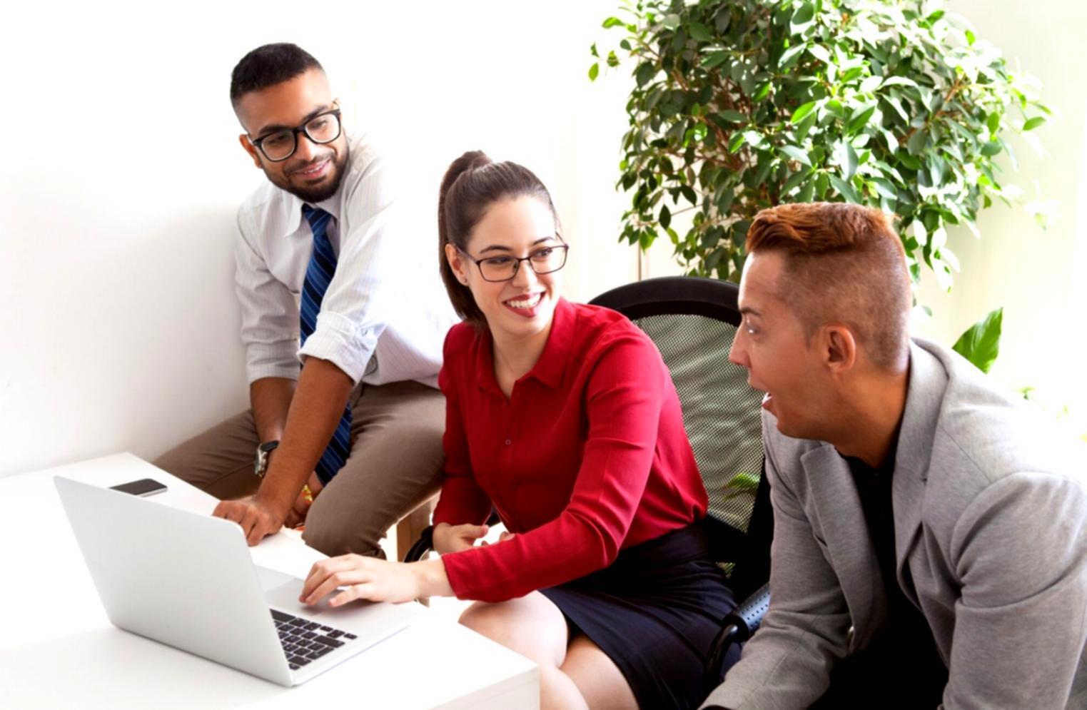 Corporate event planning training session with team members reviewing venue layouts and coordination materials